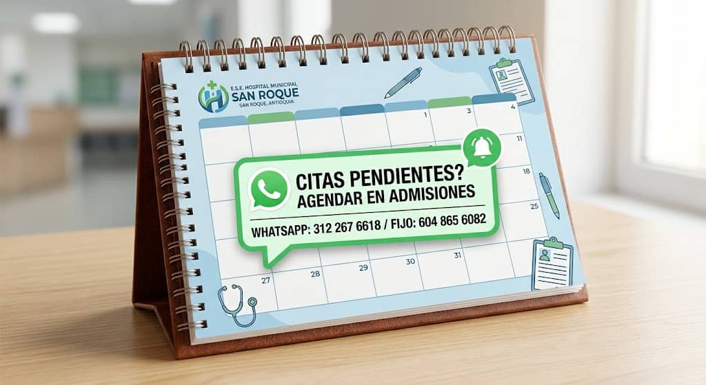 Hospital de San Roque informa cómo agendar citas pendientes de fisioterapia Calendario de escritorio sobre una mesa con un mensaje destacado de WhatsApp sobre agendamiento de citas de fisioterapia en admisiones del Hospital Municipal San Roque.